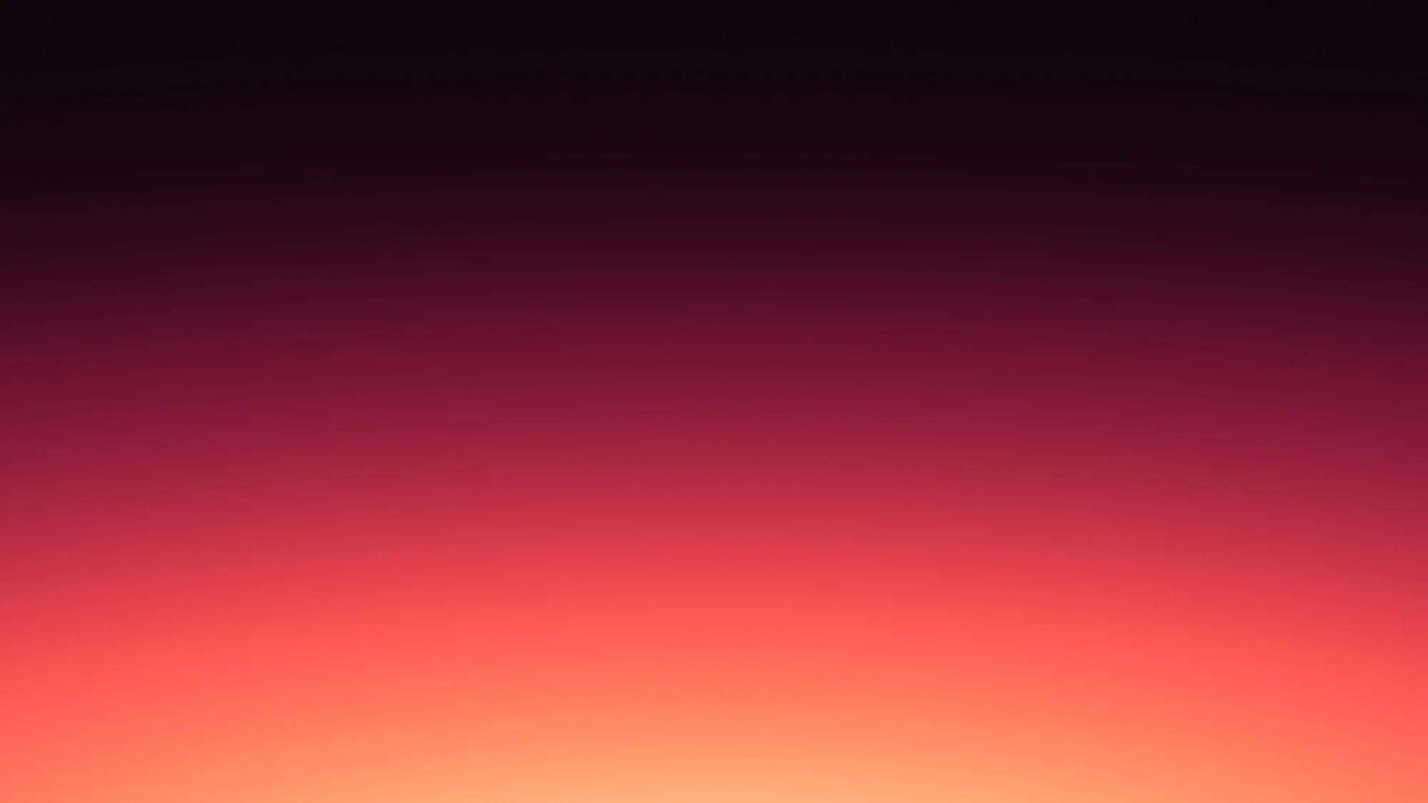 Coral Dusk: Dusky maroon sky glowing coral and apricot where it meets the bottom edge.